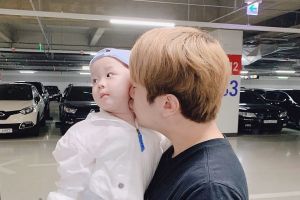 Minhwan of FTISLAND s'excuse d'avoir fait un lancer dangereux en tenant son fils dans ses bras