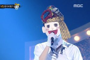 Le chanteur du groupe populaire surprend tout le monde dans "The King Of Mask Singer"